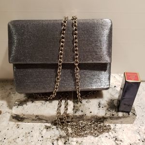 Small purse and lipstick.